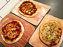 Photo of sourdough pizzas with a mix of toppings Sourdough pizzas with a mix of toppings